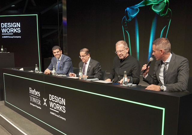 Officials of Magnom Properties and Designworks, a BMW Group Company sign the deal.